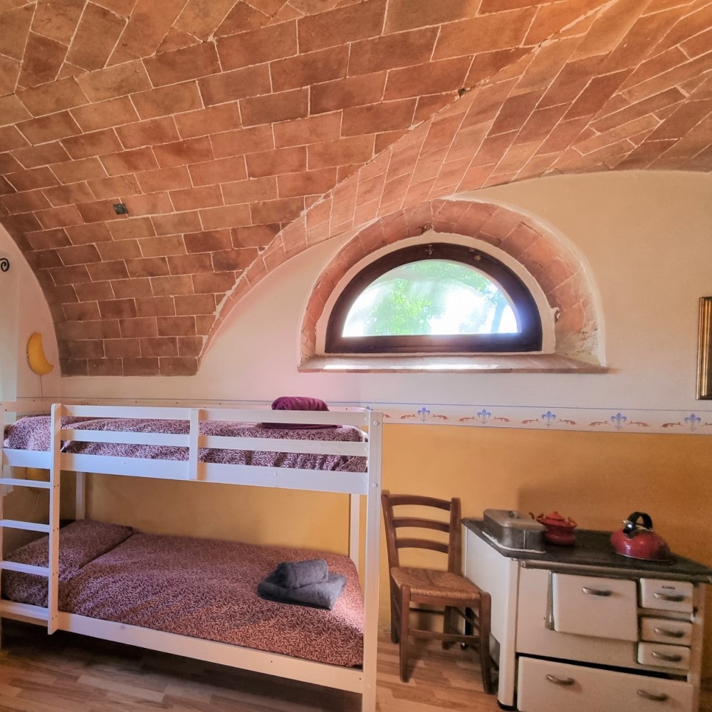 chambre de l'appartement vacances en Italie